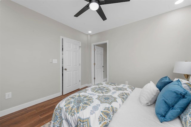 bedroom featuring ceiling fan and dark hardwood / wood-style flooring