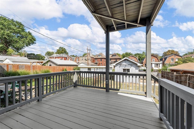 wooden deck with a storage shed