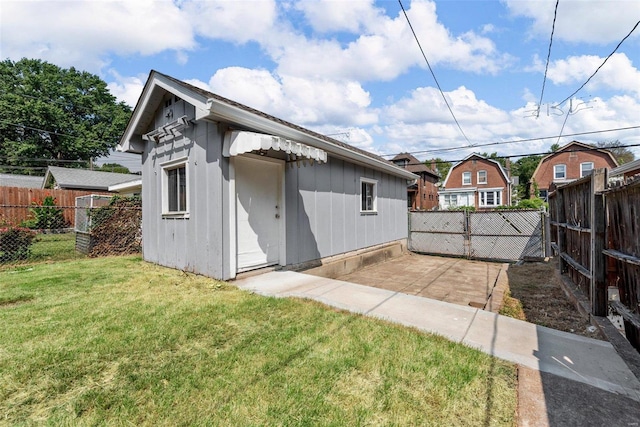 rear view of house with a yard