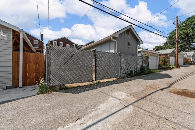 view of side of property with a garage and an outdoor structure