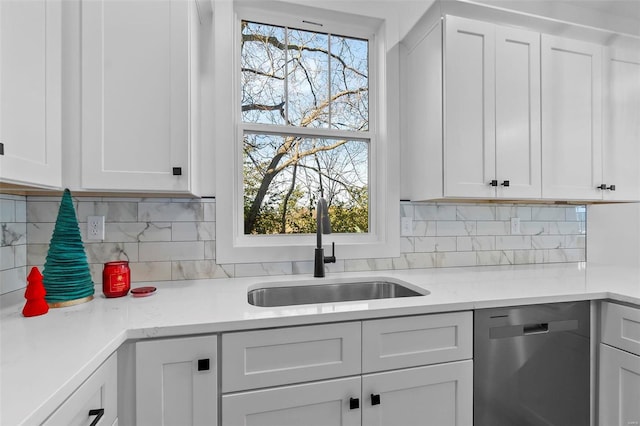 kitchen featuring dishwasher and white cabinetry