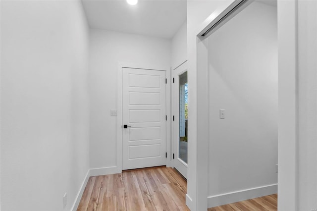 hall with light hardwood / wood-style floors