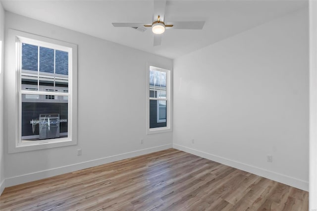 unfurnished room with ceiling fan and light hardwood / wood-style floors