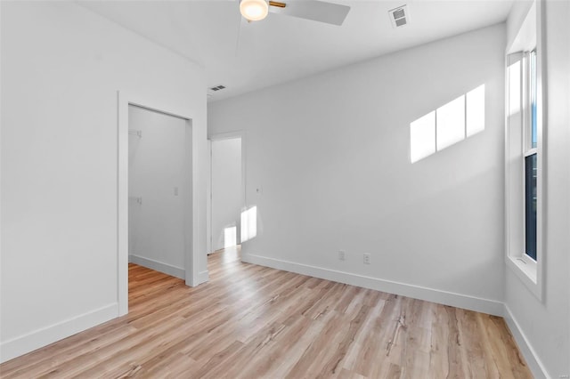 unfurnished room featuring ceiling fan and light hardwood / wood-style floors