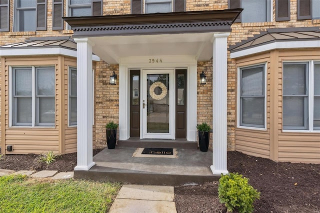 doorway to property featuring covered porch