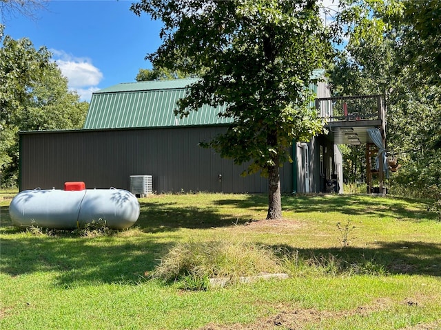 view of yard with central air condition unit