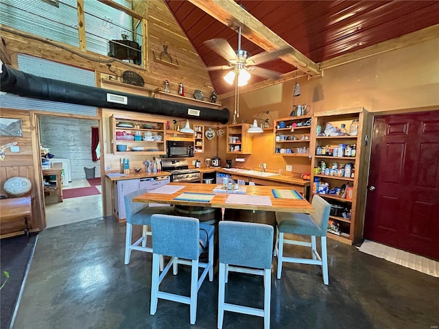 dining room featuring wood ceiling, beamed ceiling, ceiling fan, sink, and high vaulted ceiling