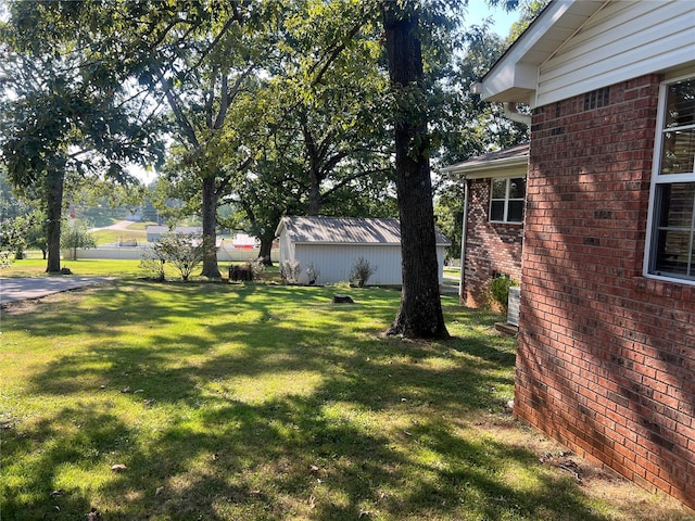 view of yard with a storage unit