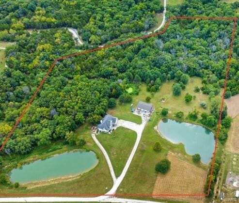 drone / aerial view featuring a water view