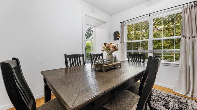 dining area with wood finished floors and baseboards