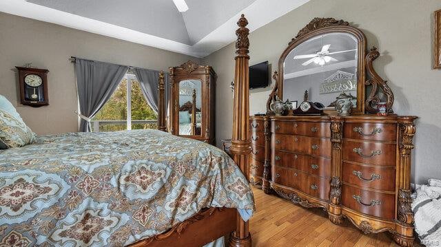 bedroom featuring vaulted ceiling, ceiling fan, and hardwood / wood-style floors