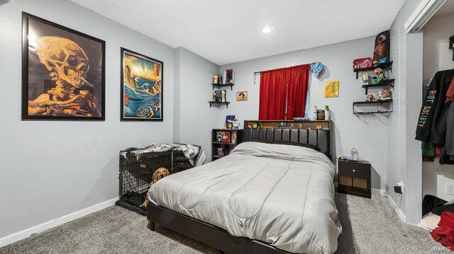 bedroom featuring carpet and baseboards