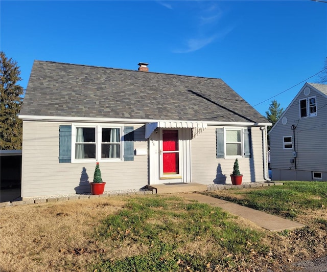 bungalow with a front yard