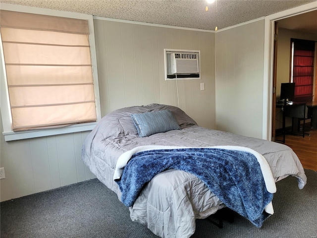 bedroom featuring a wall mounted air conditioner