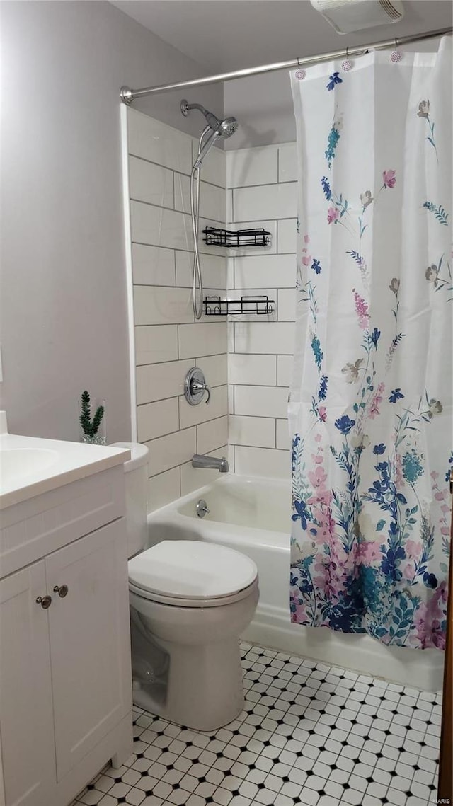 full bath featuring toilet, shower / bath combo, and vanity