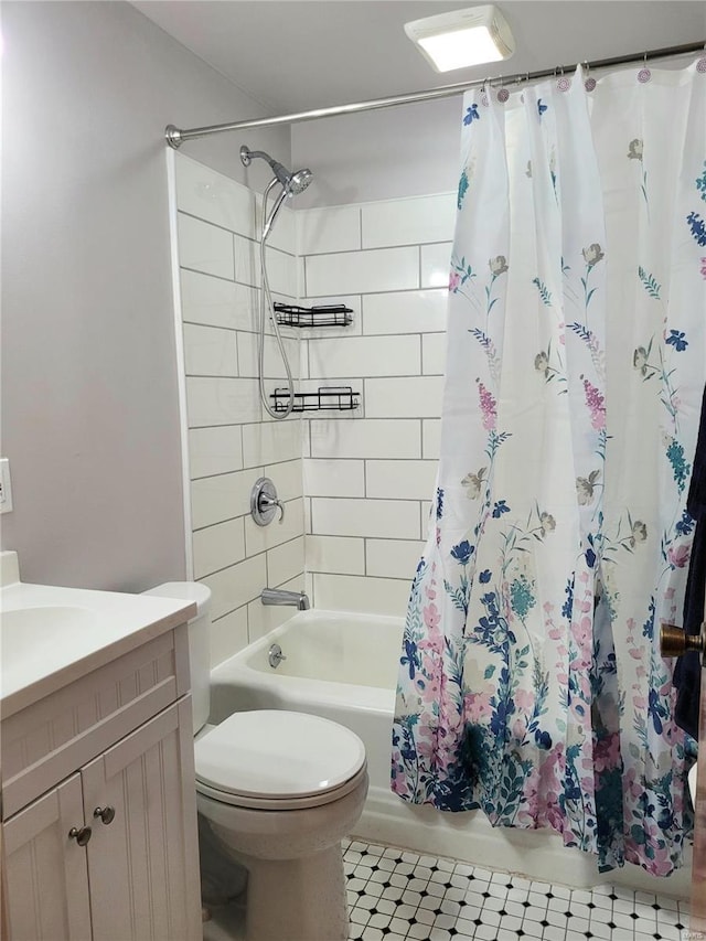 full bathroom with shower / bath combo, vanity, and toilet