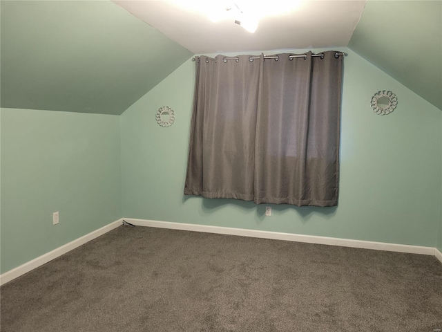 additional living space with lofted ceiling, carpet, and baseboards