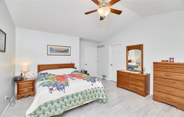 bedroom featuring lofted ceiling, ceiling fan, and light hardwood / wood-style floors