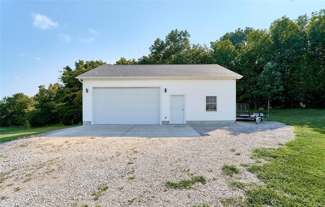 garage with a lawn