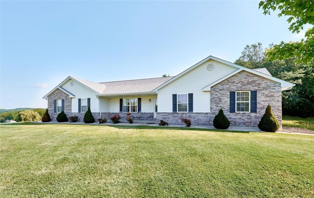 ranch-style house with a front lawn