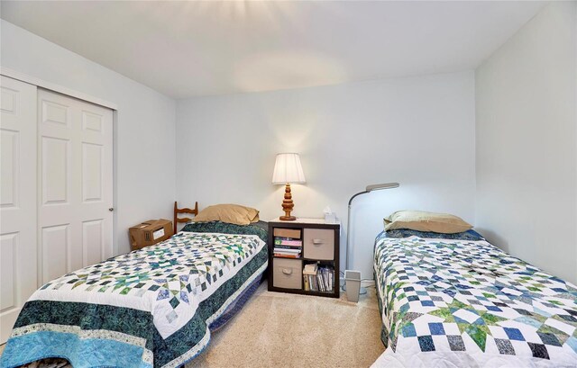 carpeted bedroom with a closet