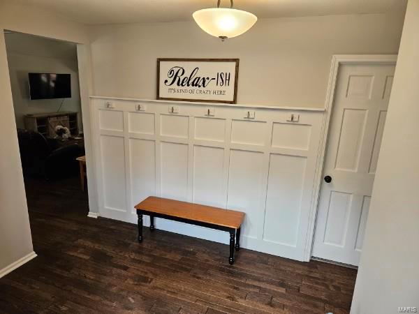 corridor featuring dark hardwood / wood-style floors