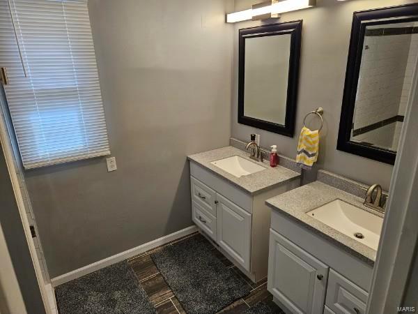 bathroom featuring vanity and hardwood / wood-style flooring