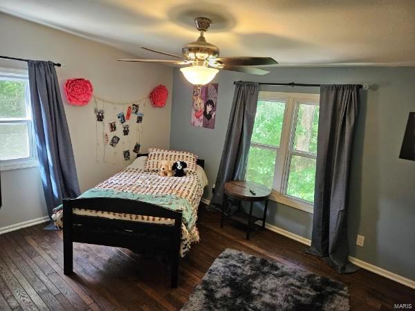 bedroom featuring ceiling fan and dark hardwood / wood-style floors