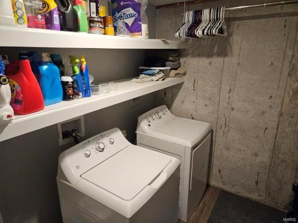 laundry area featuring washing machine and clothes dryer