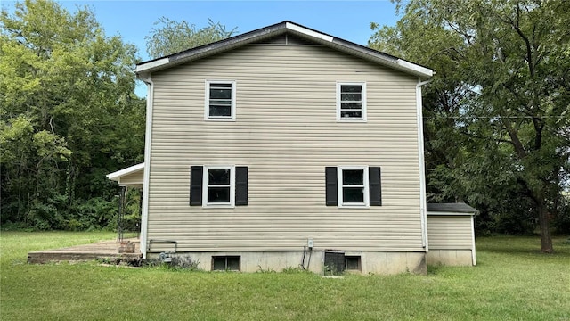 view of property exterior with a lawn