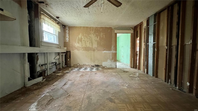 misc room with a textured ceiling and ceiling fan