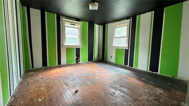 unfurnished room featuring hardwood / wood-style flooring