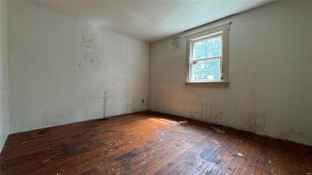 empty room with hardwood / wood-style flooring