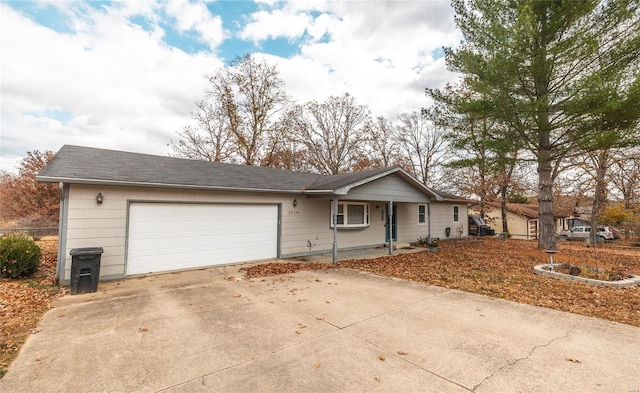 ranch-style house featuring a garage