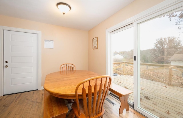 dining space with light hardwood / wood-style floors