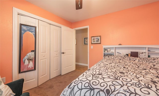 bedroom featuring a closet, ceiling fan, and light carpet