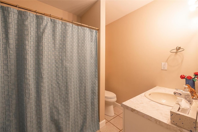 bathroom with vanity, toilet, and tile patterned floors