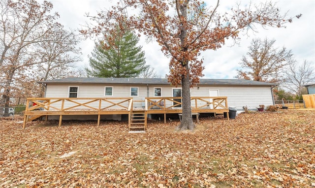 back of property featuring a deck