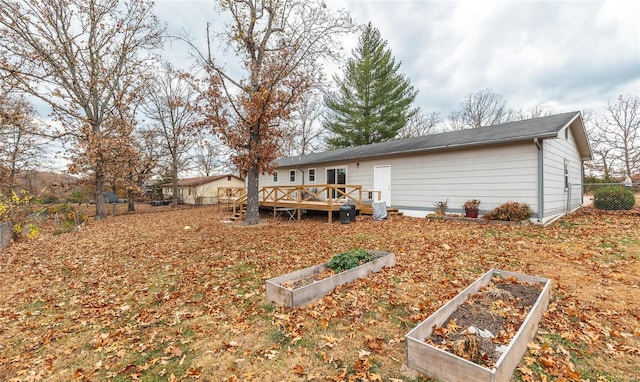 rear view of house with a deck