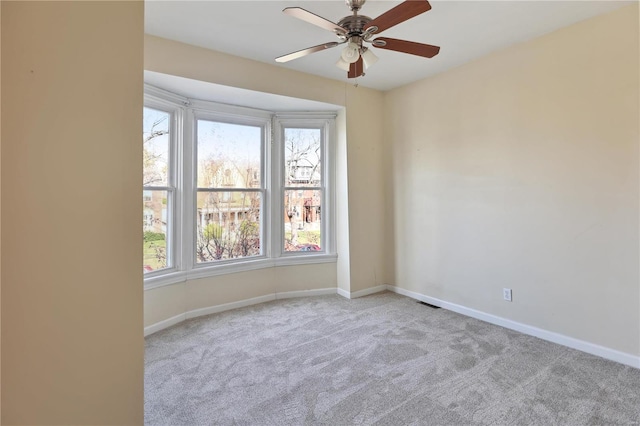 carpeted empty room with ceiling fan