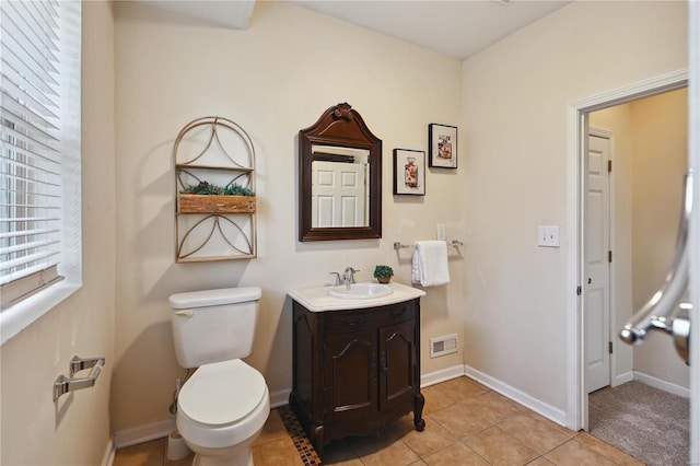 bathroom with tile patterned floors, vanity, and toilet