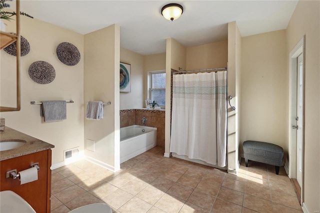 bathroom featuring tile patterned flooring, vanity, and shower with separate bathtub