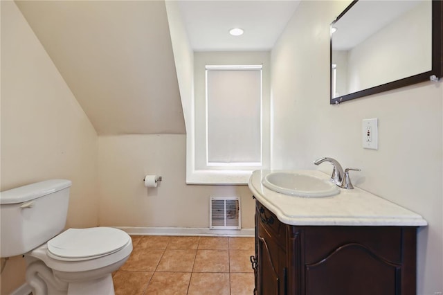 bathroom with tile patterned floors, vanity, and toilet