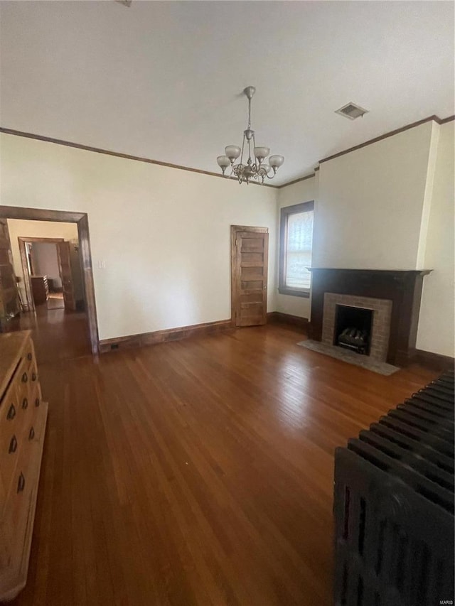 living room featuring dark hardwood / wood-style floors and a chandelier