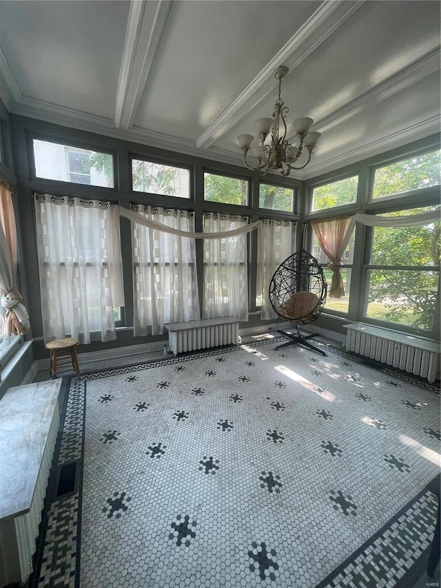 unfurnished sunroom with radiator, a notable chandelier, and plenty of natural light