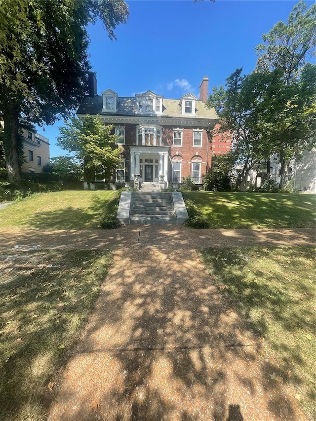 rear view of house with a lawn