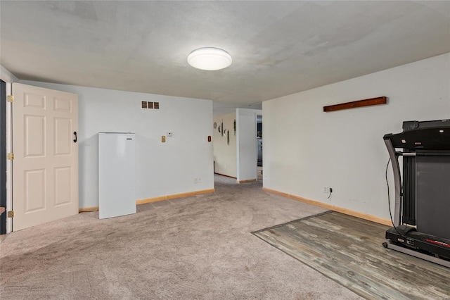 workout area with carpet floors