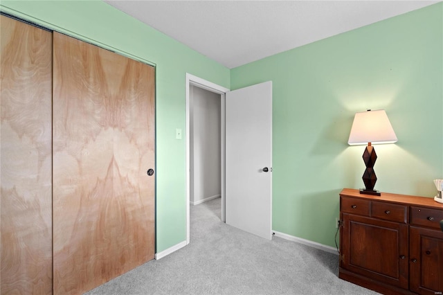 carpeted bedroom featuring a closet