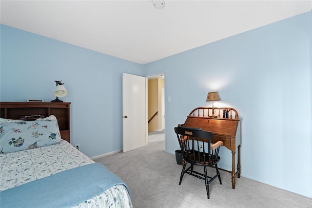 bedroom with light colored carpet