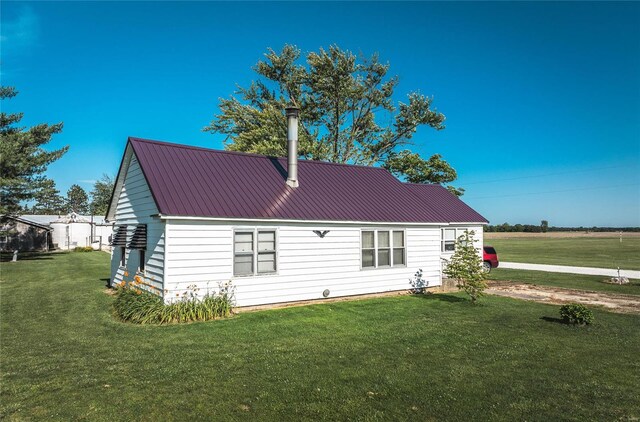 back of house with a yard